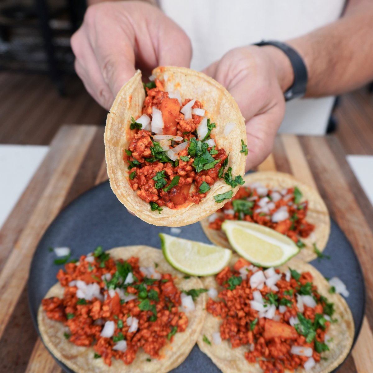 Hand held Al Pastor taco.